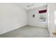 Simple bedroom with carpet flooring and a window with a view at 329 Sunset Way, Palm Harbor, FL 34683