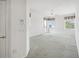 Spacious bedroom with carpet flooring and access to a balcony at 329 Sunset Way, Palm Harbor, FL 34683