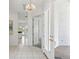 Bright entryway with tile flooring, access to kitchen and patio at 329 Sunset Way, Palm Harbor, FL 34683