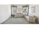 Living room with light colored couch and carpet at 329 Sunset Way, Palm Harbor, FL 34683