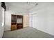 Bedroom with wood shelving unit and access to a bathroom at 329 Sunset Way, Palm Harbor, FL 34683