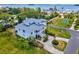 Aerial view highlighting a charming two-story home and private driveway at 329 Sunset Way, Palm Harbor, FL 34683