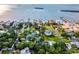 Drone view showcasing waterfront homes and a beautiful coastline at 329 Sunset Way, Palm Harbor, FL 34683