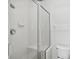 Clean bathroom with a large tiled shower and glass enclosure at 329 Sunset Way, Palm Harbor, FL 34683
