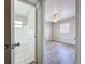 Bright bathroom featuring tiled floors, shower over tub, and a window for natural light at 1513 55Th N Ave, St Petersburg, FL 33703