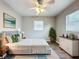Cozy bedroom with neutral walls, wood floors, and ample natural light from the windows at 1513 55Th N Ave, St Petersburg, FL 33703