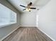 Bedroom featuring wood flooring, a ceiling fan and one large window for lots of natural light at 1513 55Th N Ave, St Petersburg, FL 33703