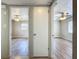 View of two bedrooms with hardwood floors and ceiling fans at 1513 55Th N Ave, St Petersburg, FL 33703