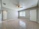 Vacant living room showing tile floors and neutral color palette at 1513 55Th N Ave, St Petersburg, FL 33703