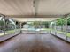 Enclosed patio with view of backyard pool and fence for privacy at 1513 55Th N Ave, St Petersburg, FL 33703