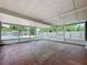 Screened-in patio providing an outdoor relaxation space with a view of the pool and backyard at 1513 55Th N Ave, St Petersburg, FL 33703