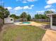 Backyard featuring a pool, shed and fenced-in yard at 1513 55Th N Ave, St Petersburg, FL 33703