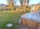 Beautiful backyard featuring a manicured lawn and an inviting jacuzzi, ideal for relaxation and outdoor enjoyment at 5144 Chime Way, Holiday, FL 34690