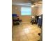 Empty bedroom with tile flooring, ceiling fan, and natural light at 5144 Chime Way, Holiday, FL 34690