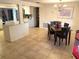 Open dining room featuring a chandelier and easy access to the kitchen at 5144 Chime Way, Holiday, FL 34690