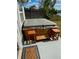 Outdoor hot tub that adds a touch of luxury and relaxation, enhanced by the addition of nearby stools at 5144 Chime Way, Holiday, FL 34690