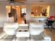 Bright living room with tile flooring, open floor plan, and views of the dining and kitchen area at 5144 Chime Way, Holiday, FL 34690