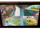 Security monitor showing various camera feeds of the property's exterior, offering enhanced safety and surveillance at 5144 Chime Way, Holiday, FL 34690