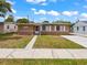 Cute ranch style home with a well manicured lawn at 1513 55Th N Ave, St Petersburg, FL 33703