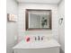 Modern bathroom with white subway tile, marble vanity, and updated fixtures at 2511 Dolly Bay Dr # 308, Palm Harbor, FL 34684