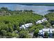 Aerial view of waterfront community nestled amongst trees at 2511 Dolly Bay Dr # 308, Palm Harbor, FL 34684