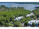 Aerial view showing building's waterfront location and surrounding nature at 2511 Dolly Bay Dr # 308, Palm Harbor, FL 34684