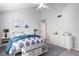 Primary bedroom with white dresser and blue bedding at 2511 Dolly Bay Dr # 308, Palm Harbor, FL 34684