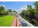 Relaxing boardwalk path leading to waterfront with lush greenery at 2511 Dolly Bay Dr # 308, Palm Harbor, FL 34684