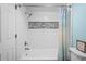 Updated bathroom with white subway tile shower and niche at 2511 Dolly Bay Dr # 308, Palm Harbor, FL 34684