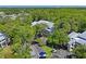 Aerial view of community featuring parking and lush landscaping at 2511 Dolly Bay Dr # 308, Palm Harbor, FL 34684