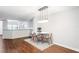 Dining area with hardwood floors and modern light fixture at 2511 Dolly Bay Dr # 308, Palm Harbor, FL 34684