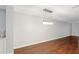 Bright dining room features hardwood floors and a modern light fixture at 2511 Dolly Bay Dr # 308, Palm Harbor, FL 34684