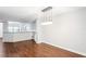 Spacious dining area with hardwood floors and kitchen views at 2511 Dolly Bay Dr # 308, Palm Harbor, FL 34684