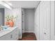 Hallway with white doors and dark hardwood floors at 2511 Dolly Bay Dr # 308, Palm Harbor, FL 34684