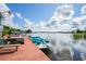 Community boat dock with various watercraft at 2511 Dolly Bay Dr # 308, Palm Harbor, FL 34684