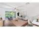 Living room with hardwood floors, comfy seating and access to balcony at 2511 Dolly Bay Dr # 308, Palm Harbor, FL 34684