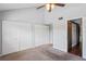 Main bedroom with vaulted ceiling, carpet, and double closets at 2511 Dolly Bay Dr # 308, Palm Harbor, FL 34684