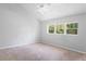 Bright bedroom with vaulted ceilings, ceiling fan, and carpet at 2511 Dolly Bay Dr # 308, Palm Harbor, FL 34684