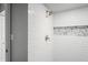 Shower with white subway tile and stone accent at 2511 Dolly Bay Dr # 308, Palm Harbor, FL 34684