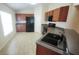 Well-lit kitchen featuring wooden cabinets, black appliances, and lots of counter space at 9048 Southern Charm Cir, Brooksville, FL 34613