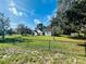 House with a chain link fence and large yard at 2013 Finland Dr, Spring Hill, FL 34609