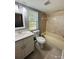 Updated bathroom with white vanity, and new flooring at 2013 Finland Dr, Spring Hill, FL 34609