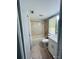 Bathroom with tub, toilet and vanity with white cabinets at 2013 Finland Dr, Spring Hill, FL 34609