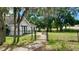 House with a chain link fence and large yard at 2013 Finland Dr, Spring Hill, FL 34609