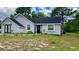 Gray house with black accents and large yard at 2013 Finland Dr, Spring Hill, FL 34609