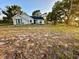 House with a large, unlandscaped front yard at 2013 Finland Dr, Spring Hill, FL 34609