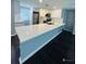 Modern kitchen with white cabinets, quartz countertops, and an island at 2013 Finland Dr, Spring Hill, FL 34609