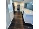 Modern kitchen with white cabinets, quartz countertops, and stainless steel appliances at 2013 Finland Dr, Spring Hill, FL 34609