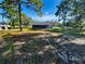 Spacious backyard with shed and plenty of green space at 2013 Finland Dr, Spring Hill, FL 34609