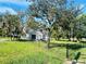 House with a chain link fence and large yard at 2013 Finland Dr, Spring Hill, FL 34609